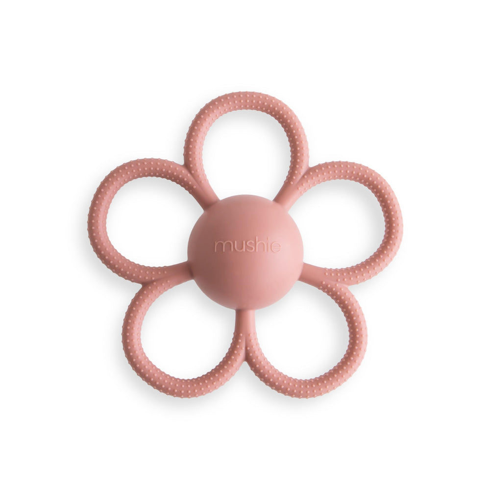 Mushie Daisy Rattle Teether in Dusty Rose with built-in rattle for sensory play.