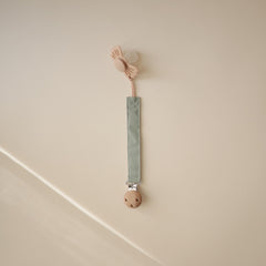 Mushie pacifier clip faux-wood clasp keeps pacifier within reach