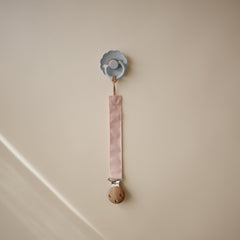 Mushie pacifier clip with soft fabric strap and durable clasp