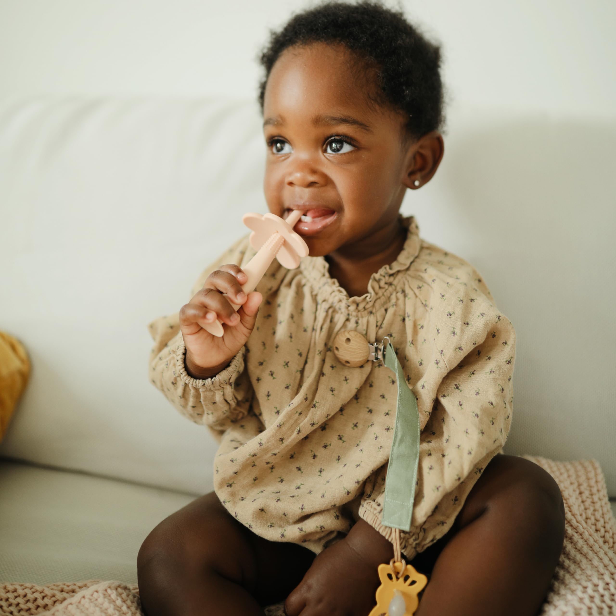 Mushie pacifier clip interior water-resistant coating visible