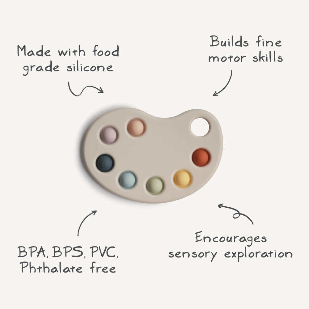 Mushie Paint Palette Press Toy arts and crafts-inspired look for kids.