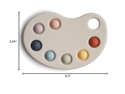 Mushie Paint Palette Press Toy pops bubbles for satisfying tactile play.