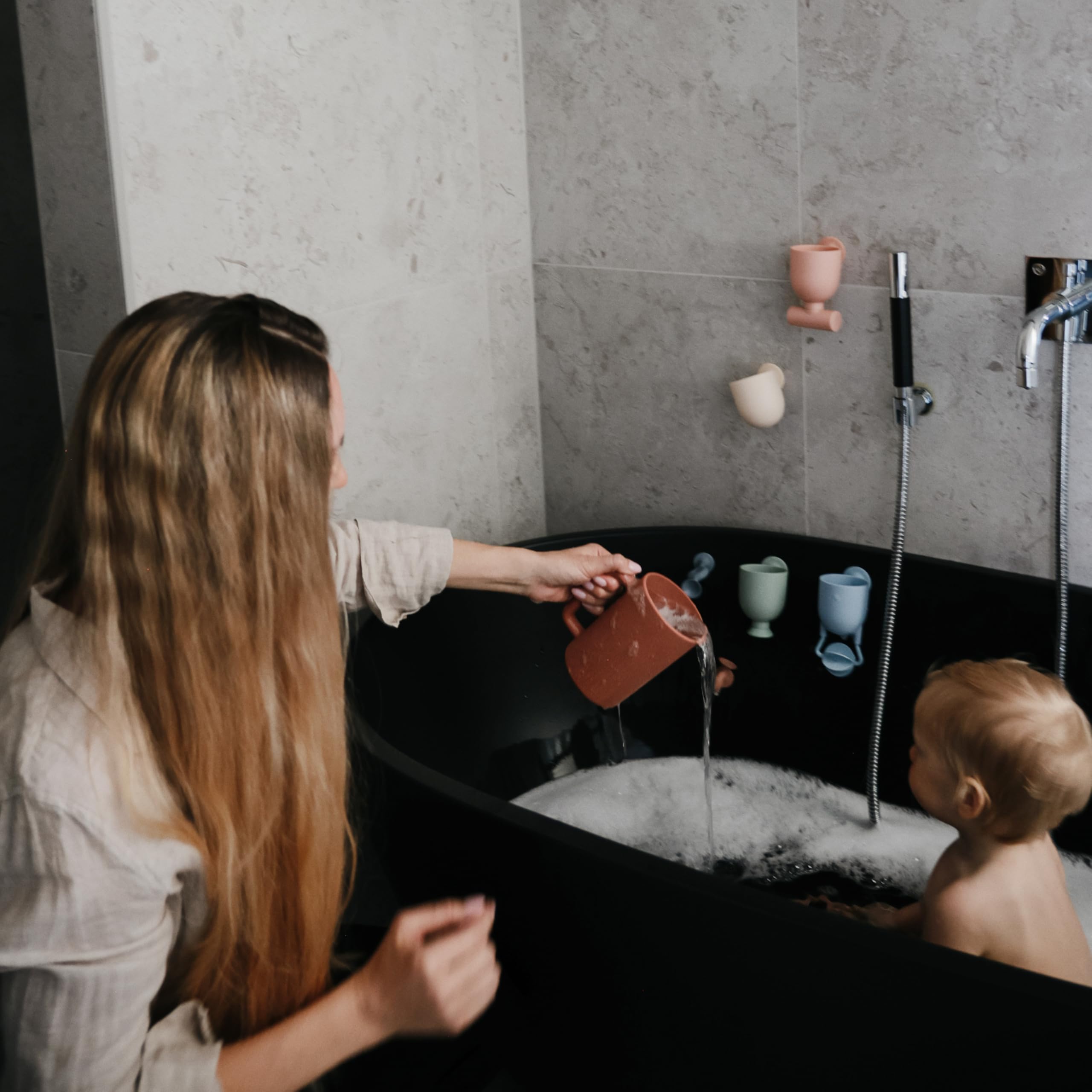 Mushie compact design fits small hands for easy grasp during bath play.