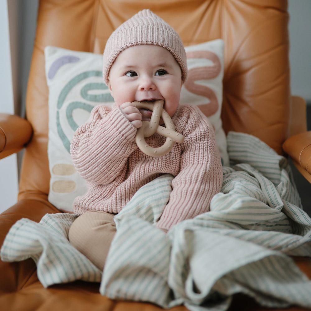 Mushie Pretzel teether close-up texture emphasizes soft silicone chew