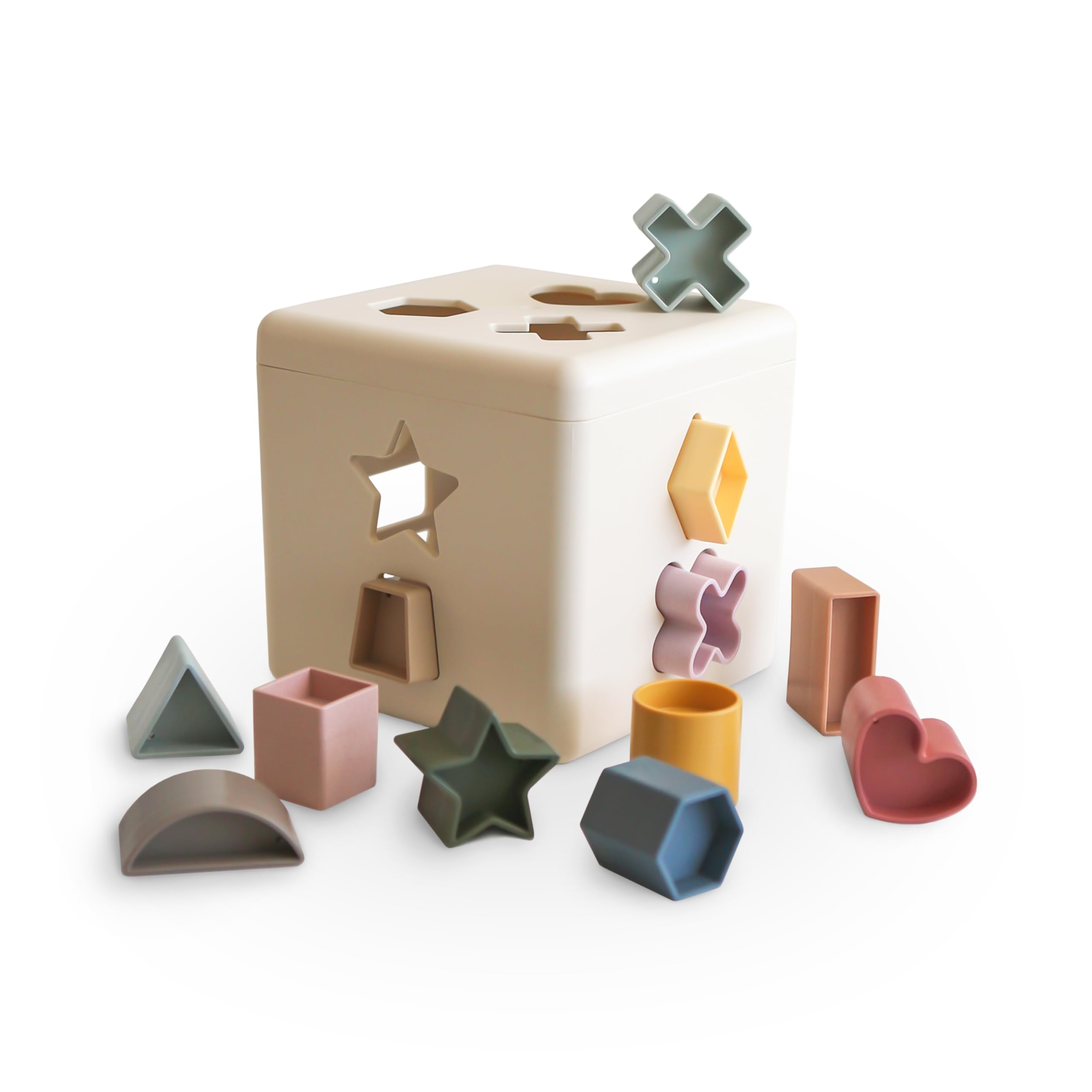 Mushie Shape Sorting Box Original with open lid promotes hands-on shape learning.