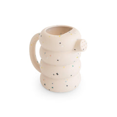 Mushie silicone watering can in vanilla confetti for bath time play and gentle pouring.
