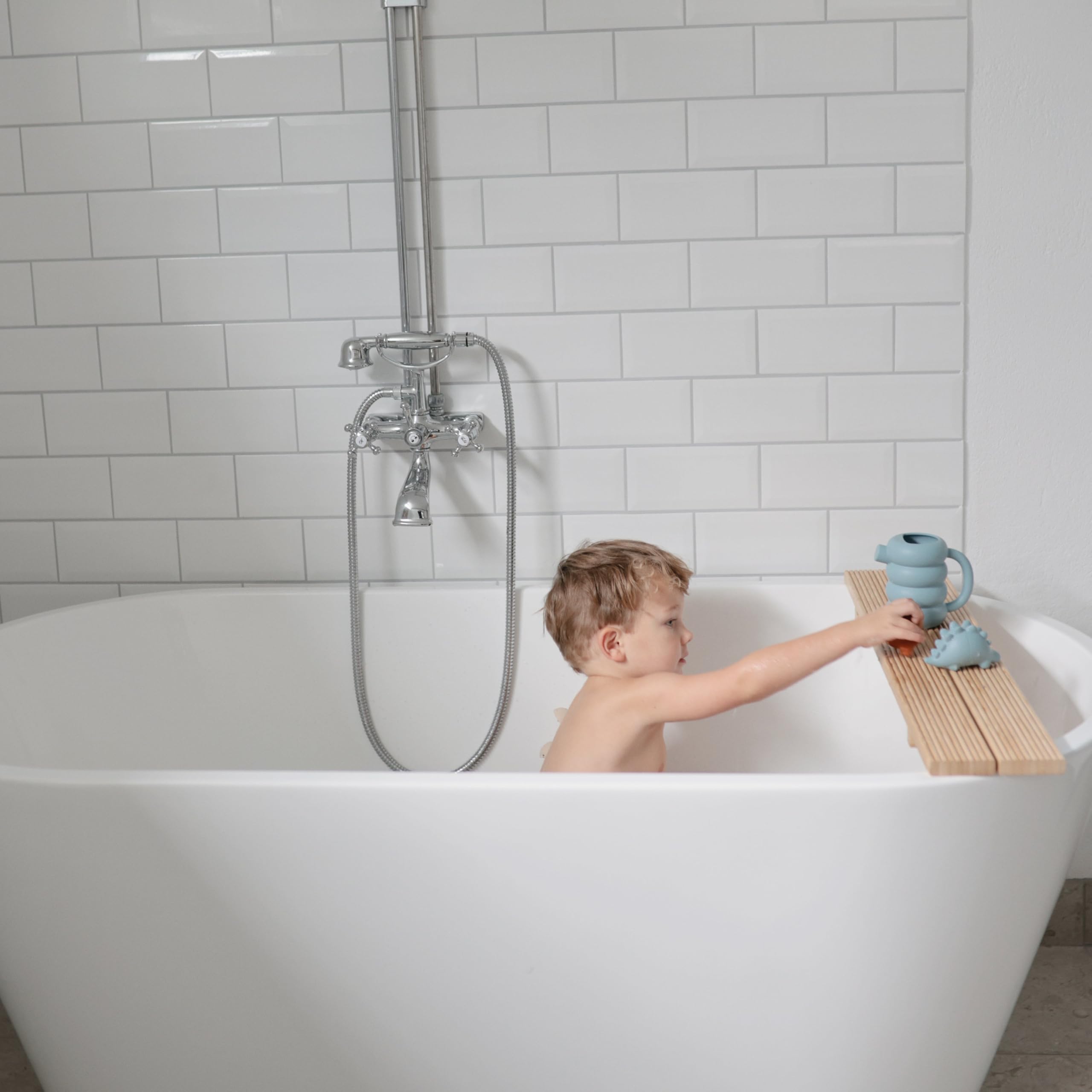 Mushie silicone watering can is a safe, tactile bath toy for sensory play.