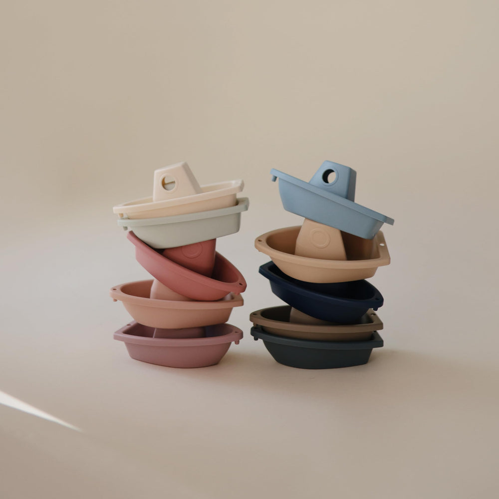 Colorful Mushie Ocean boats linked for independent bath play