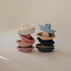Colorful Mushie Ocean boats linked for independent bath play