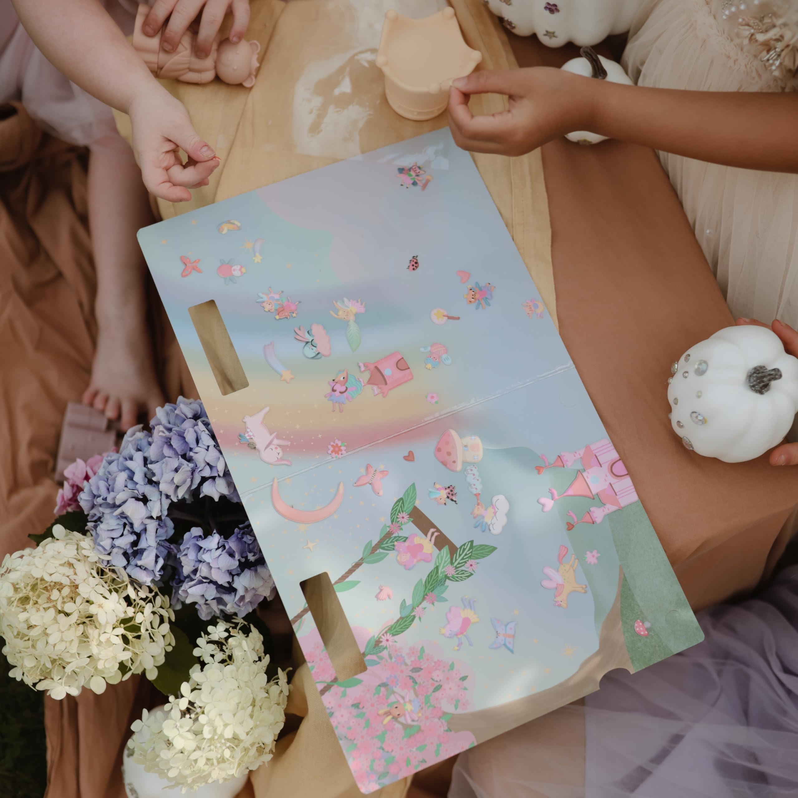 Mushie sticker book easy-grip cutouts top support little hands during play