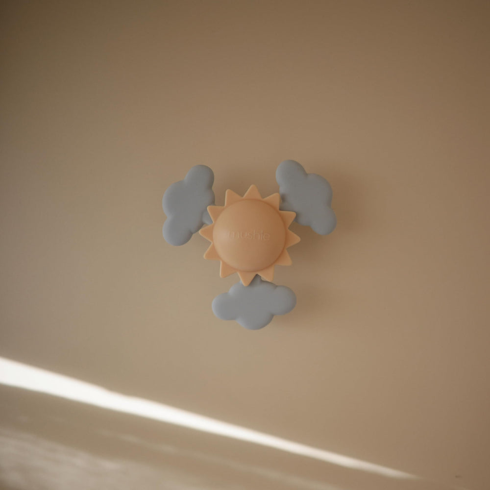 Mushie Sunshine Suction Spinner Toy spins softly to support visual tracking during play.
