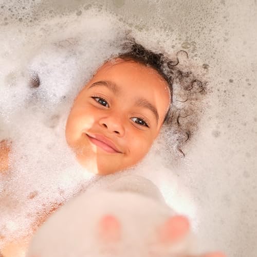 Mustela baby hair and body wash in use during bath time.