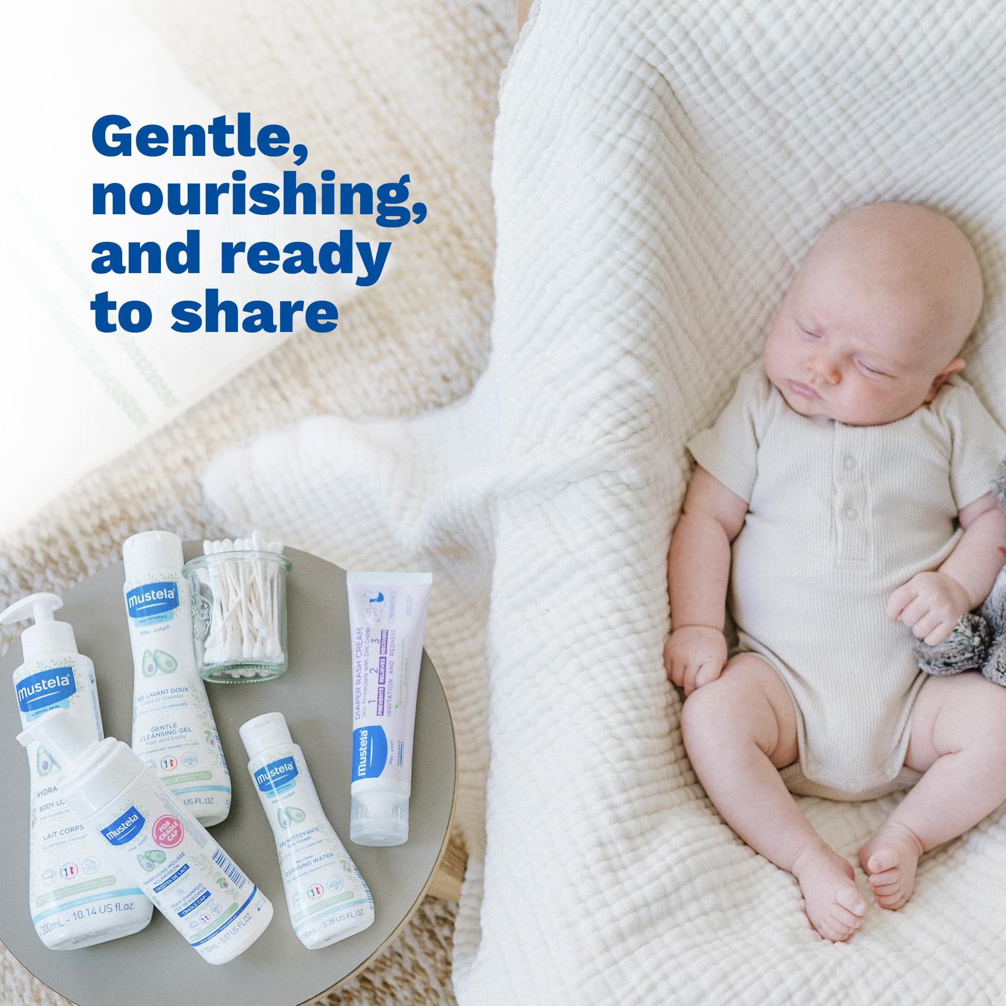 Parent holds Mustela baby skin care essentials for a routine.