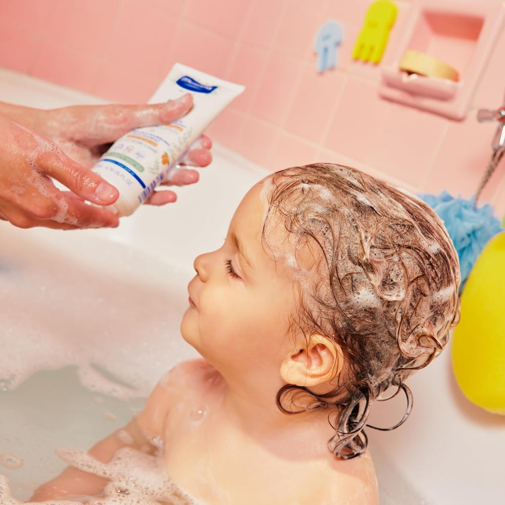 Mustela curly hair definition with shea butter for defined curls.