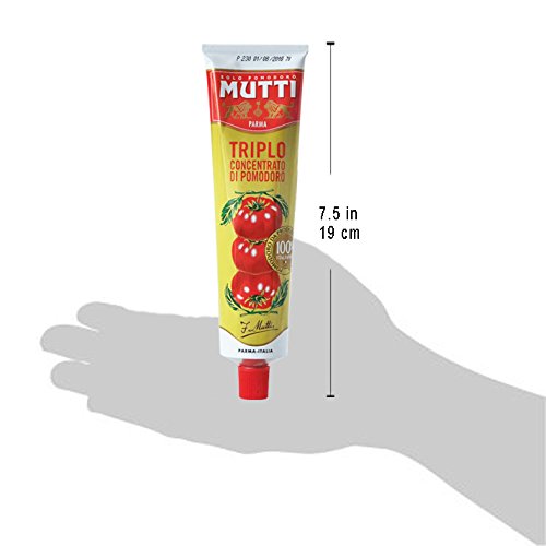 Mutti rich tomato paste poured over pasta for depth of flavor