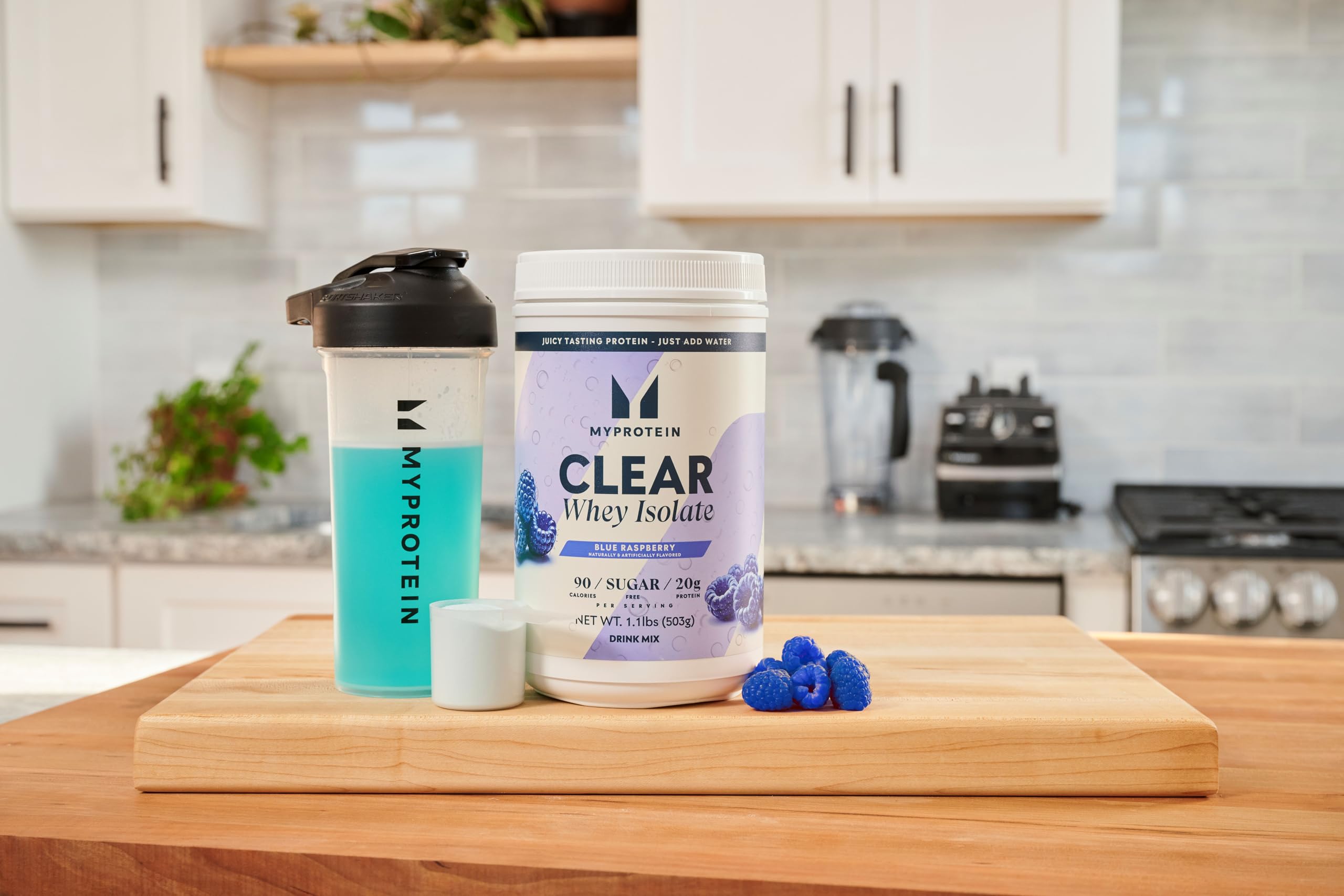 Myprotein Clear Whey Isolate blue raspberry scoop and jar imply convenient protein boost