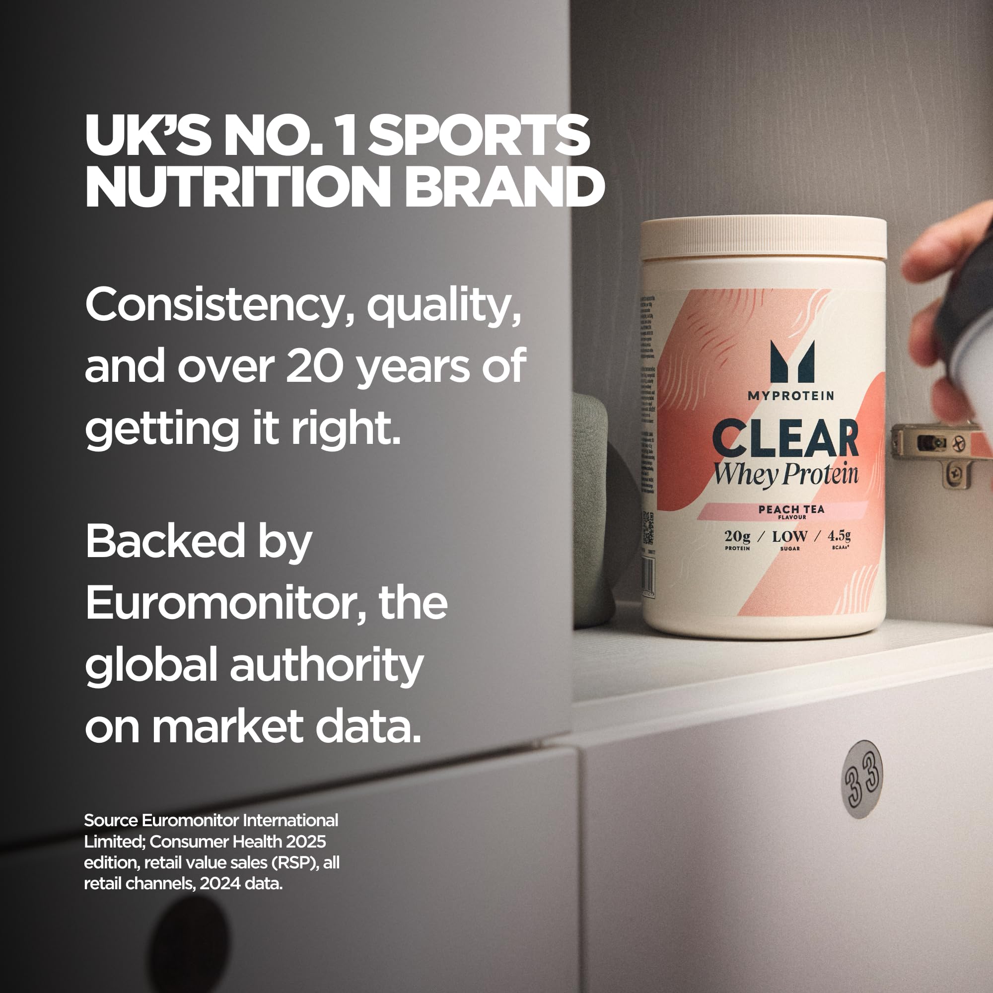 Myprotein Clear Whey Isolate Fruit Punch scoop beside bottle for easy mixing