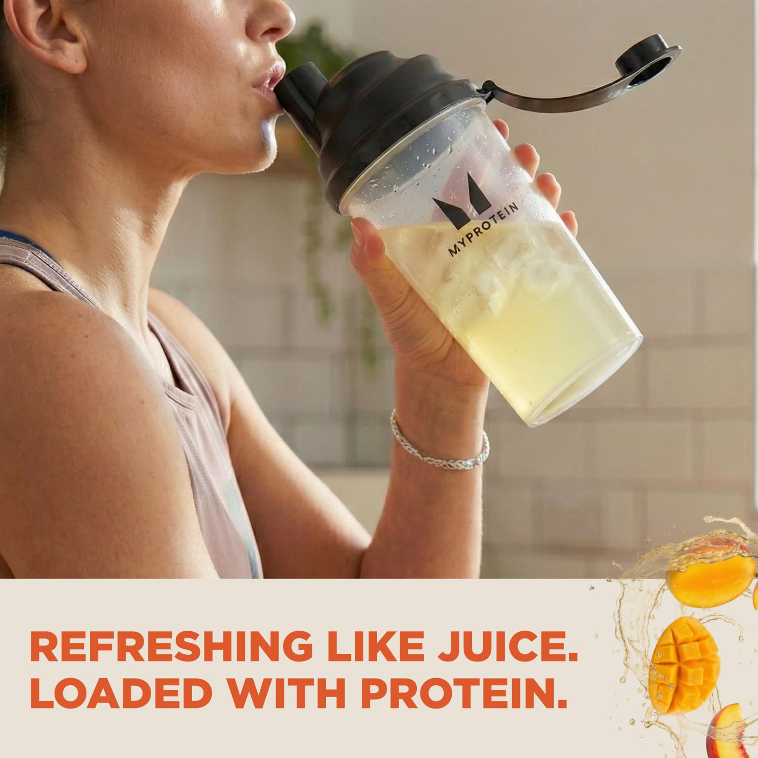 Myprotein Clear Whey Isolate Peach Mango powder tub highlights 20g protein per serving.