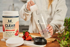 Myprotein Clear Whey Isolate Strawberry mixing with ice conveys a crisp post workout drink