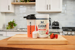 Myprotein Clear Whey Isolate Strawberry powder scoop emphasizes high protein per serving