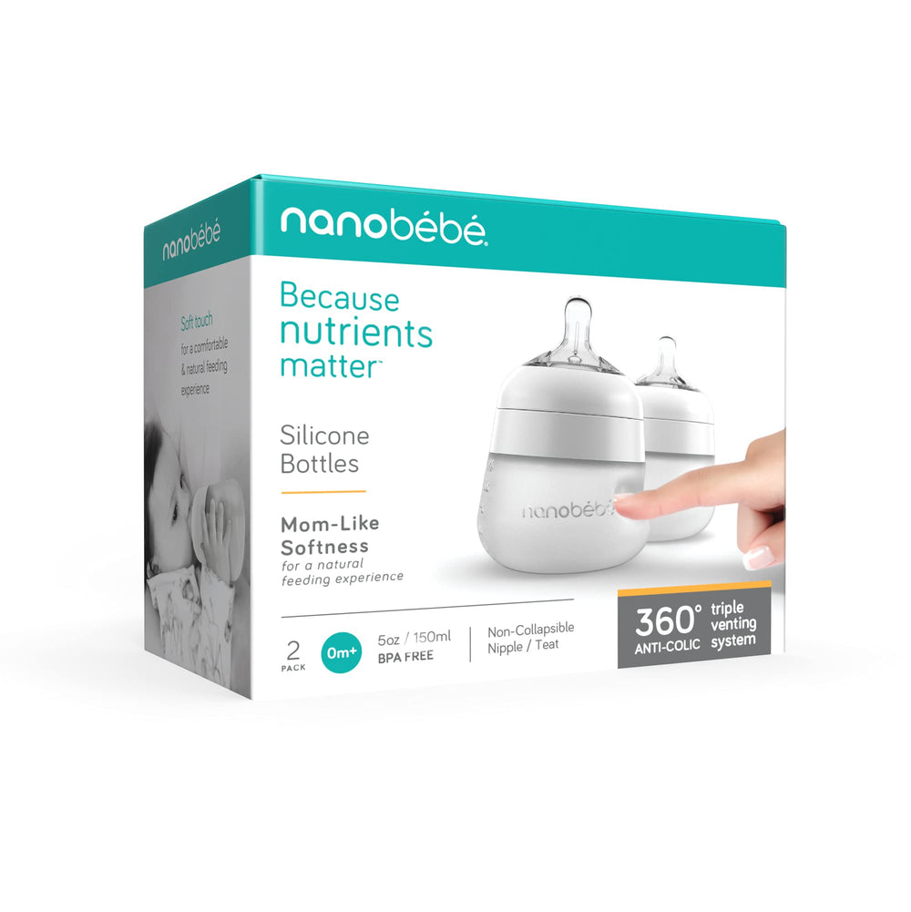 Close-up of a baby holding Nanobébé Flexy bottle during feeding milestones.