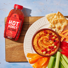 Nate's Hot Honey packaging label showing purity and award-winning flavor.