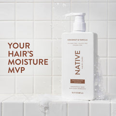 Native Coconut & Vanilla Conditioner bottle promotes silky, manageable hair.