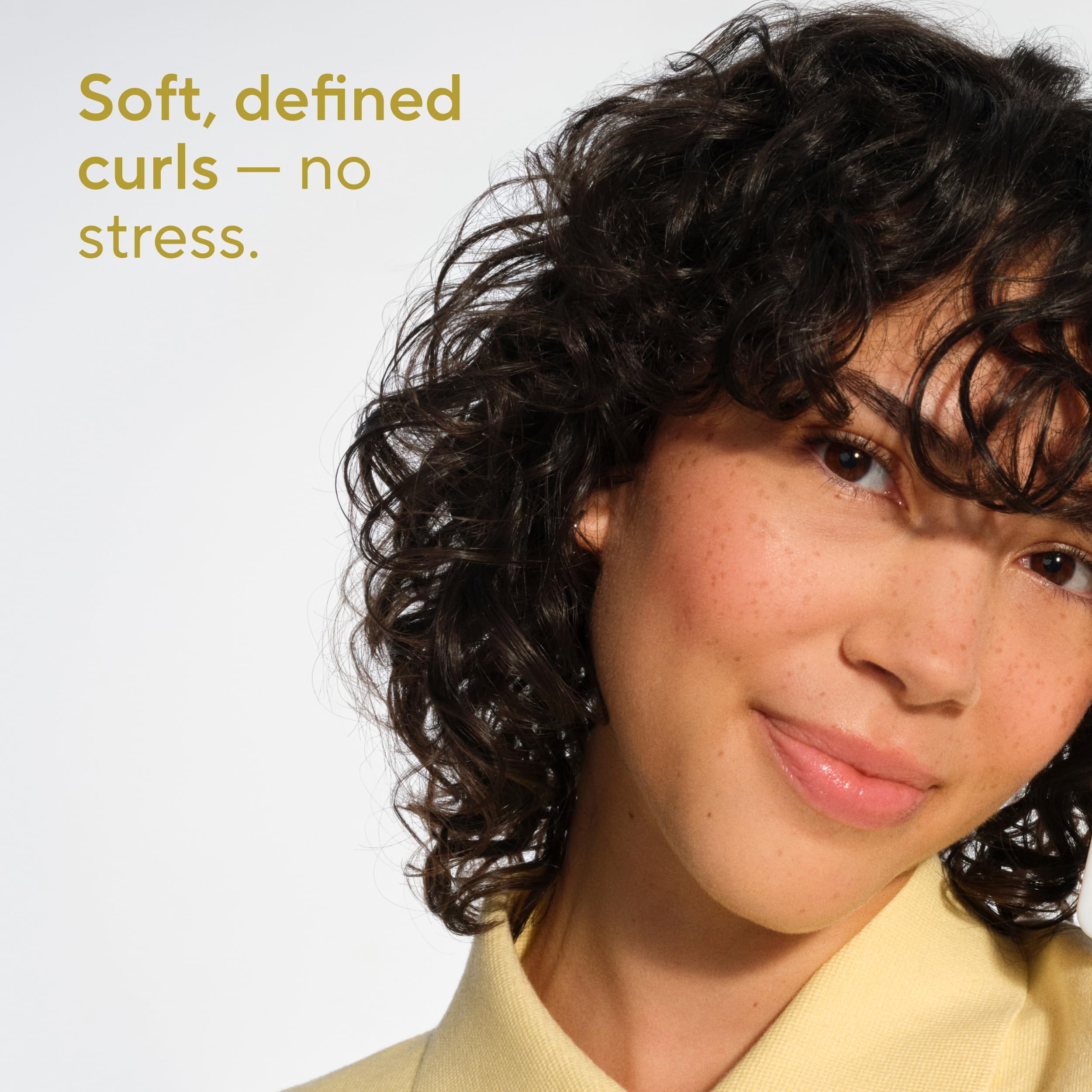 Native curl-care shampoo lather shows defined, lightweight curls.