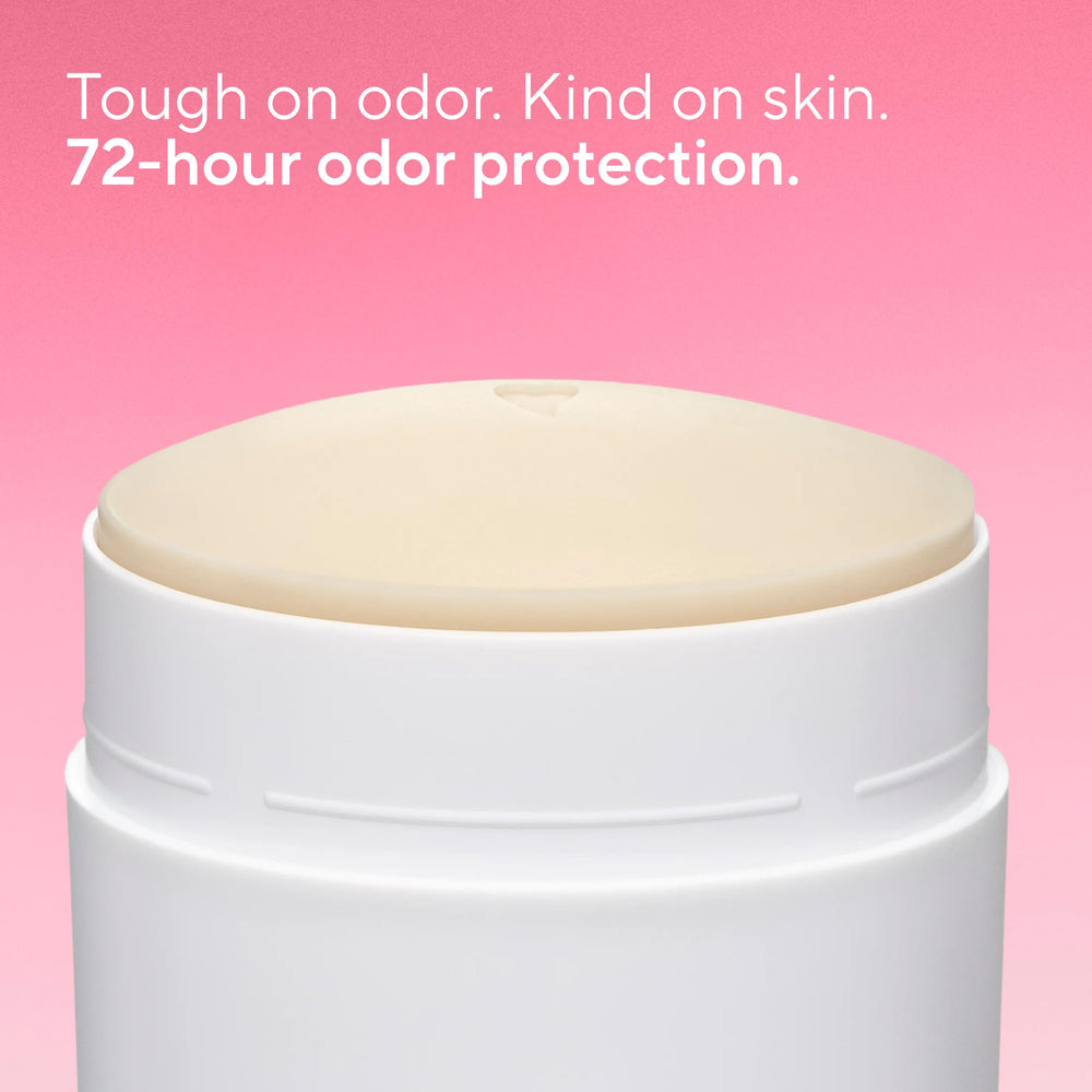 Native deodorant solid-stick closeup shows clear application and no white marks on clothing.