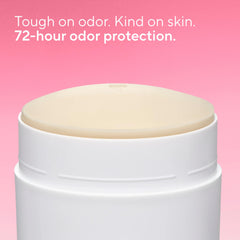 Native deodorant solid-stick closeup shows clear application and no white marks on clothing.