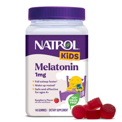 Natrol Kids Melatonin Raspberry Gummies bottle sits on a nightstand for smoother bedtimes.