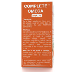 Nattura Complete Omega bottle pour captured for easy dosage during morning routine.