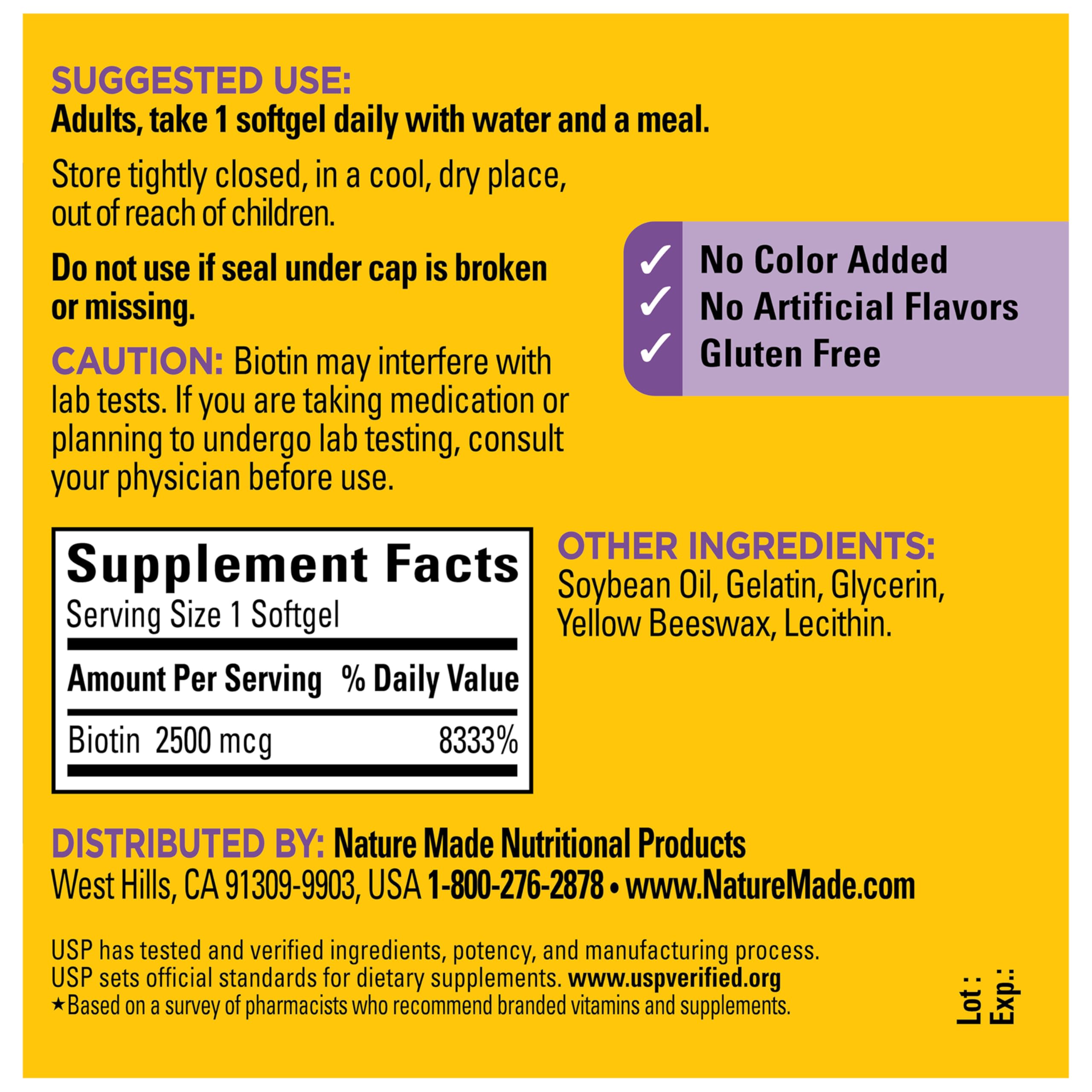Nature Made Biotin bottle resting on table in a well-lit setting.