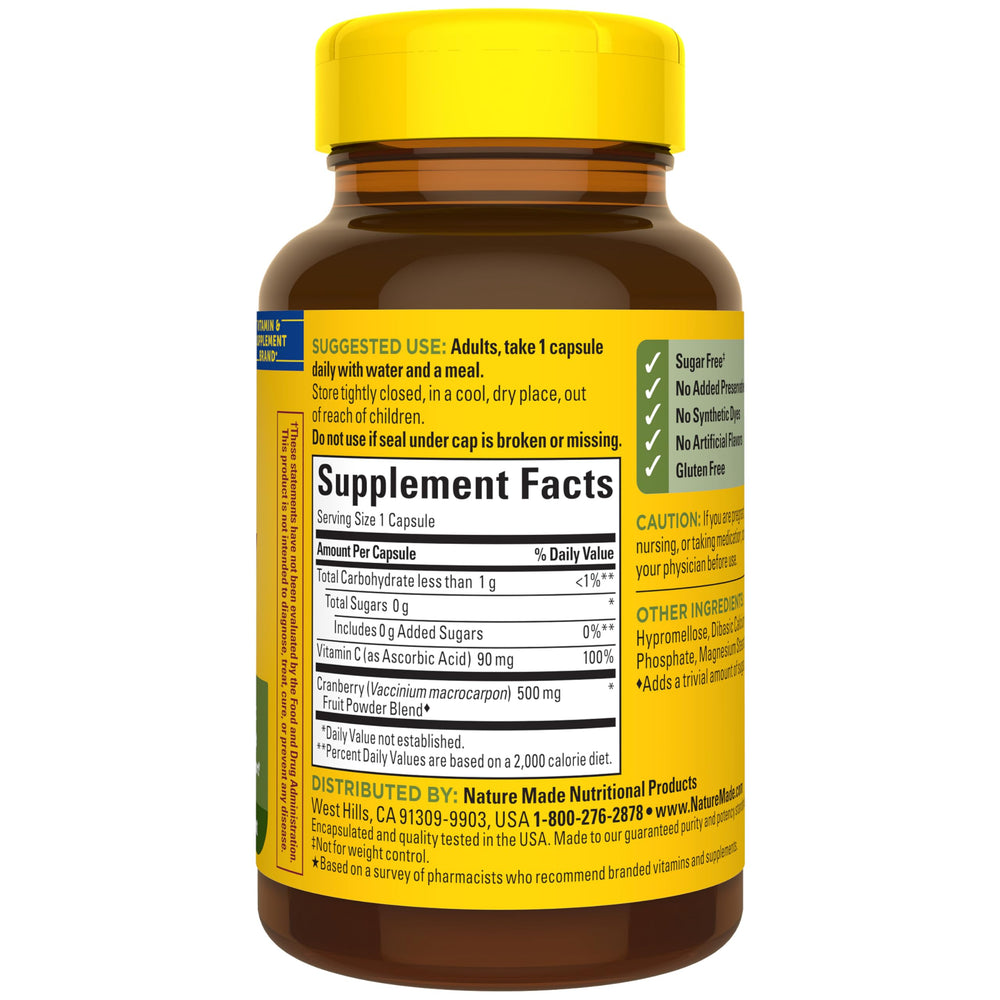 Nature Made Cranberry 500mg Vitamin C capsule on wooden surface highlights daily use