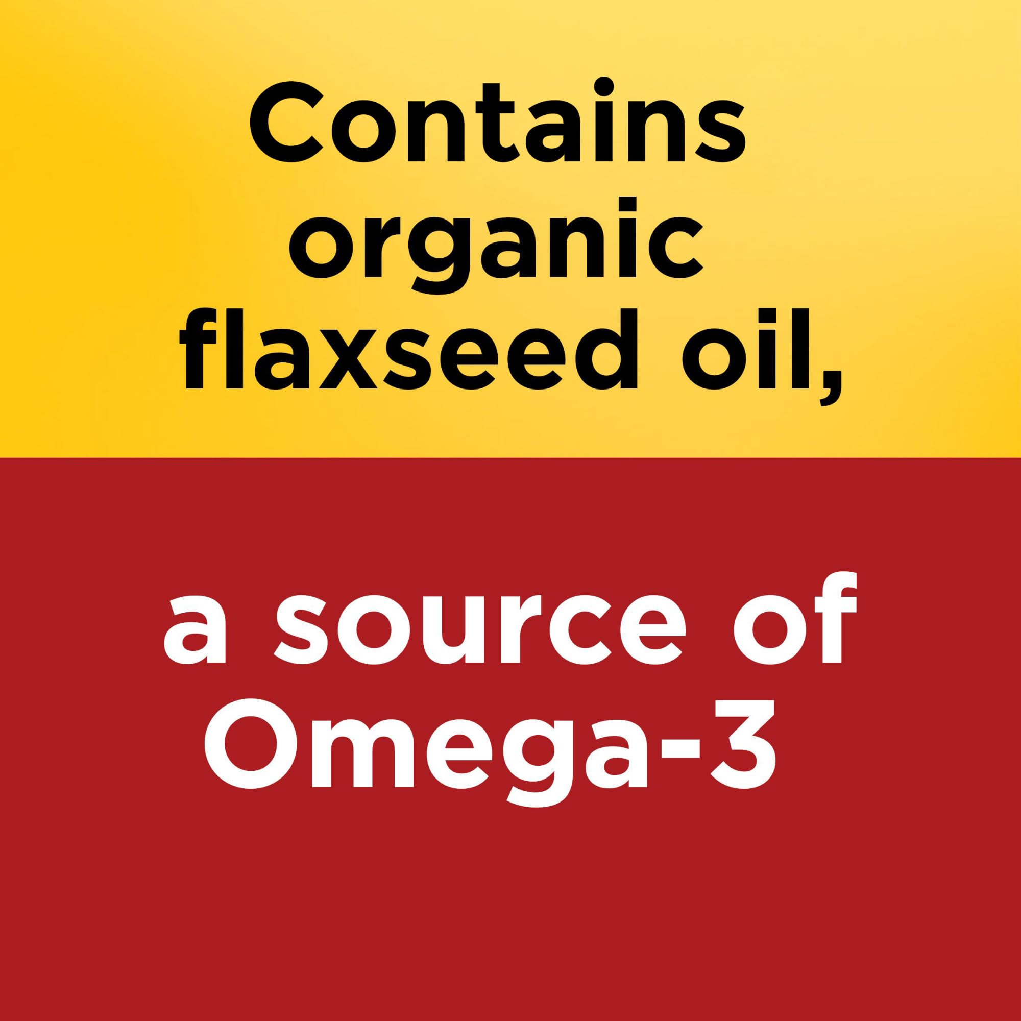 Nature Made flaxseed oil softgels being poured into glass for daily routine.