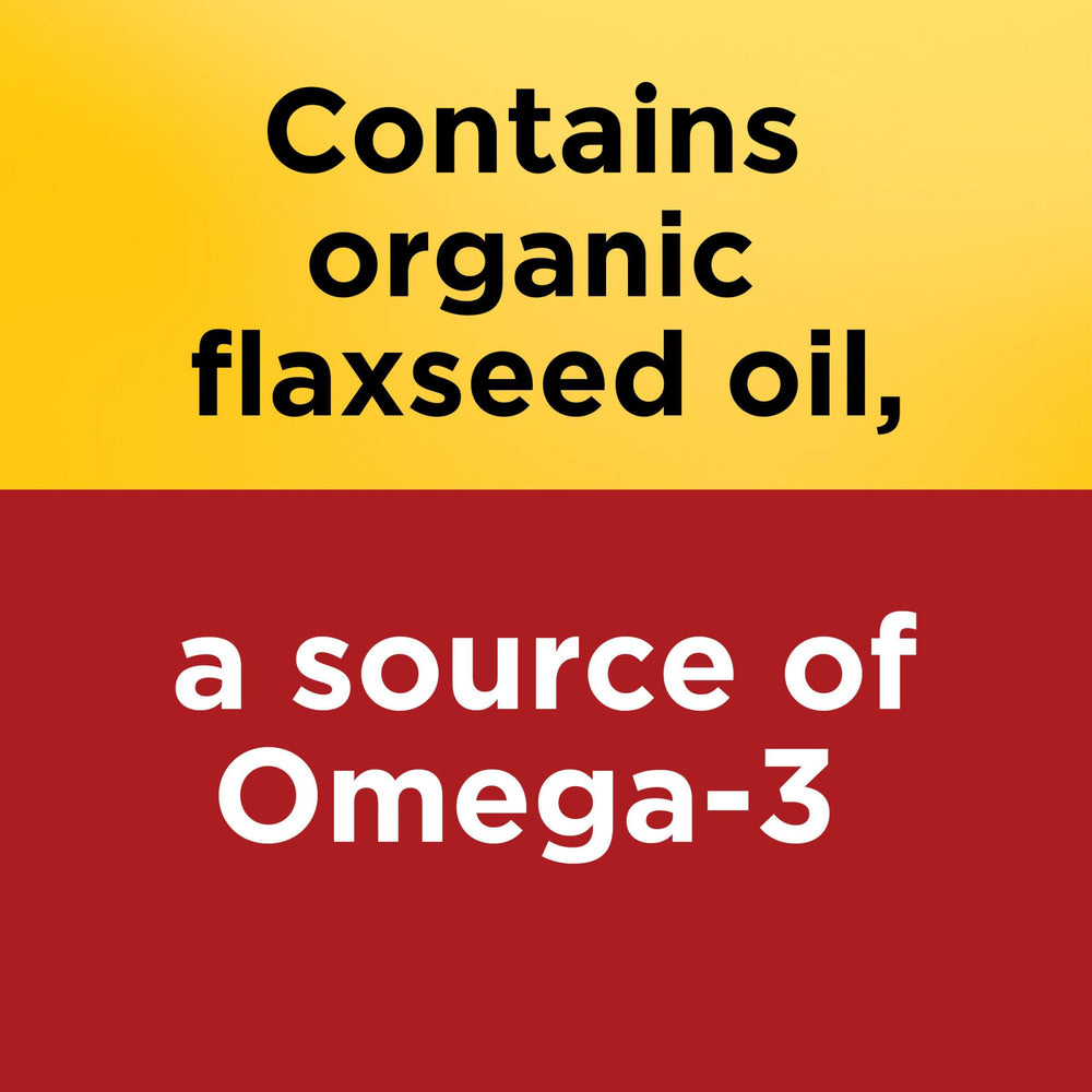 Nature Made flaxseed oil softgels being poured into glass for daily routine.