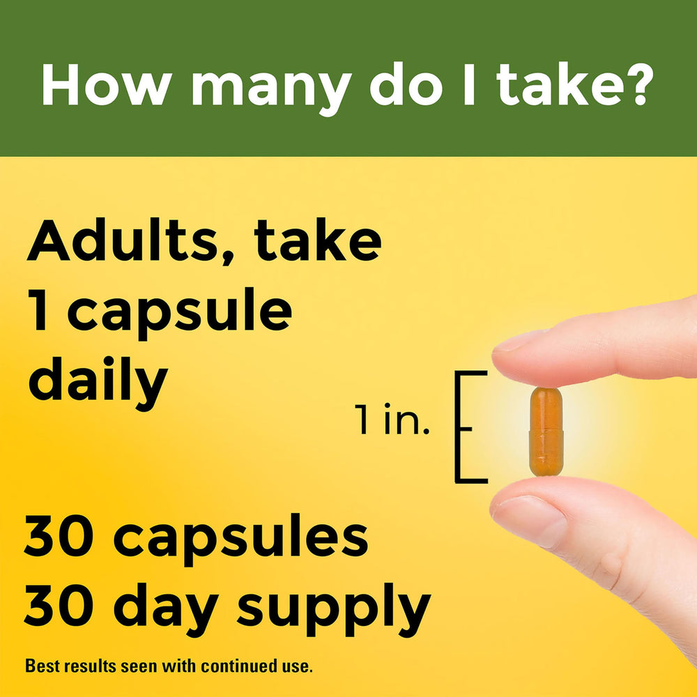 Turmeric capsules in a bottle beside a glass of water for easy daily use.