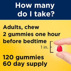 Nature Made Melatonin Gummies beside a glass of water for an easy nightly routine.
