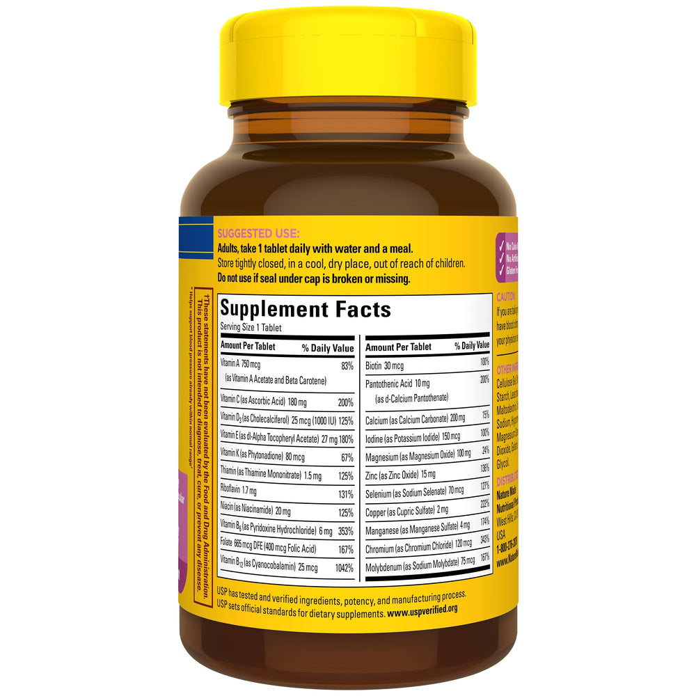 Nature Made Multivitamin For Her 50+ daily-use tablet on a clean surface