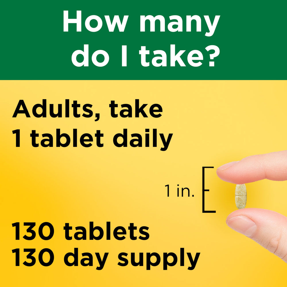 Nature Made multivitamin tablets with iron and water, ready for daily intake.