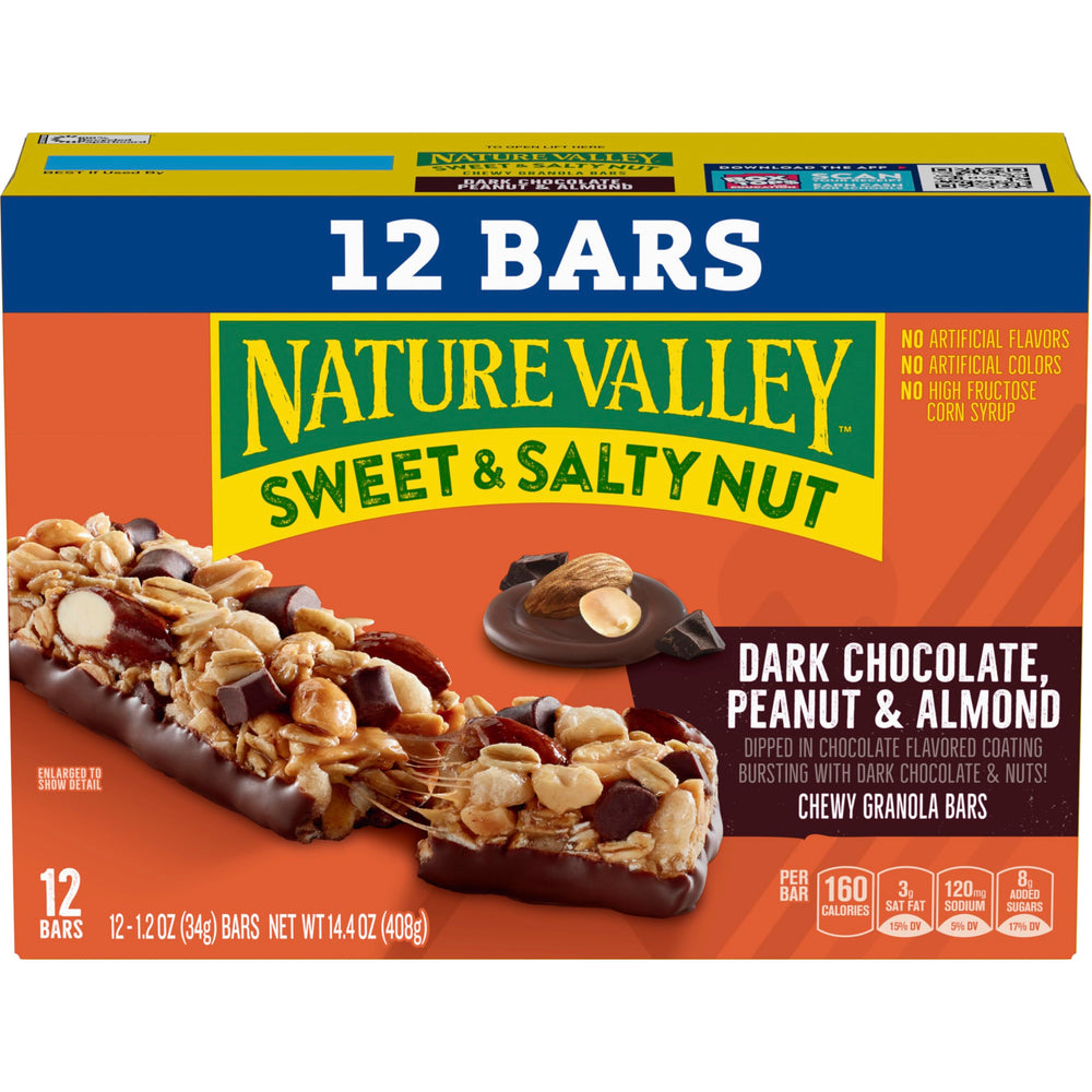 Hand holding a Nature Valley dark chocolate peanut almond bar for on-the-go energy.