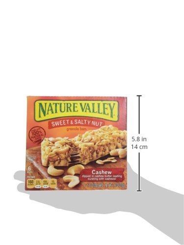 Nature Valley on-the-go bar held during outdoor activity.