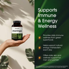 Holding NatureBell Moringa bottle for portable daily wellness.