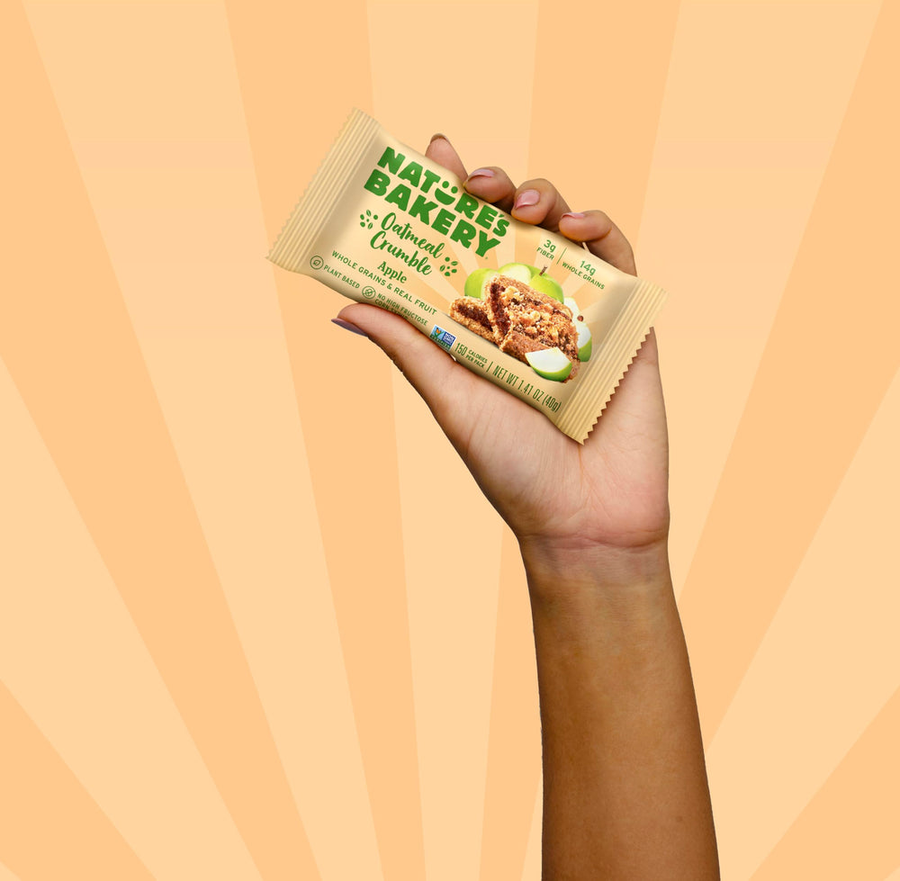 On-the-go Nature's Bakery bar beside a water bottle for travel