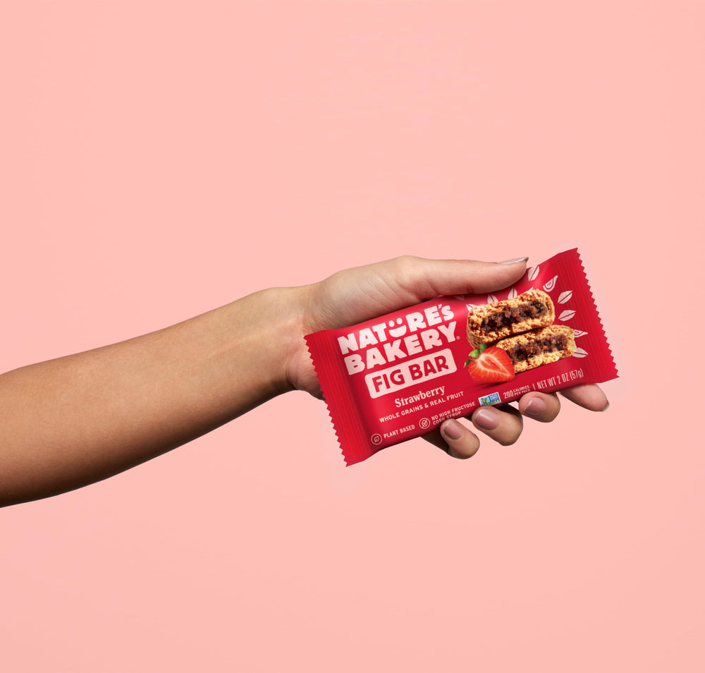 Nature's Bakery strawberry bars displayed on a store shelf for busy families
