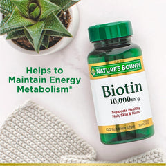 Nature's Bounty Biotin rapid-release softgels dissolving quickly for absorption.