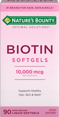 Nature's Bounty Biotin softgels bottle with 90 rapid-release capsules for hair, skin, and nails.