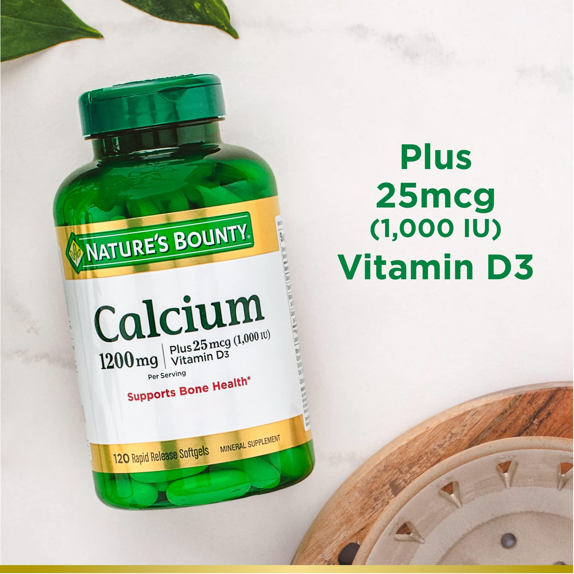 Nature's Bounty Calcium D3 softgels on counter with immune health messaging.