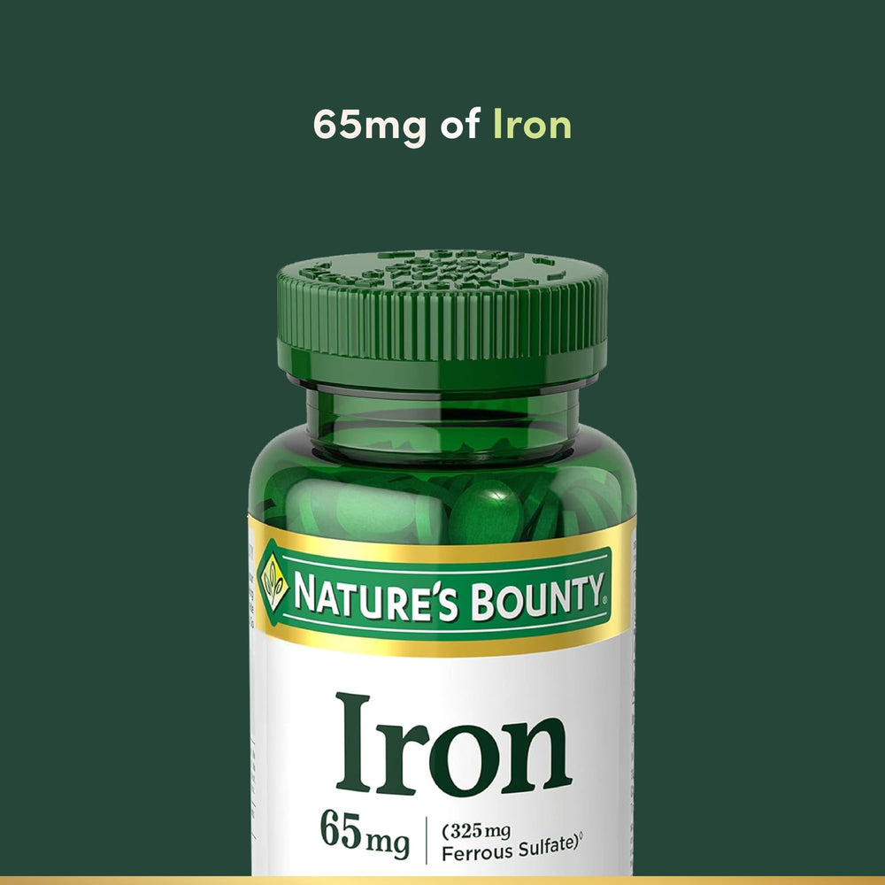 Nature’s Bounty Iron 65 mg tablet on white background for daily use.