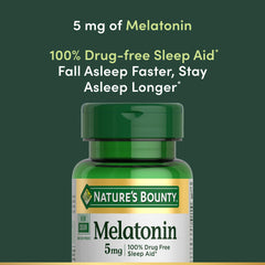 Nature's Bounty Melatonin bottle on a nightstand beside a lamp